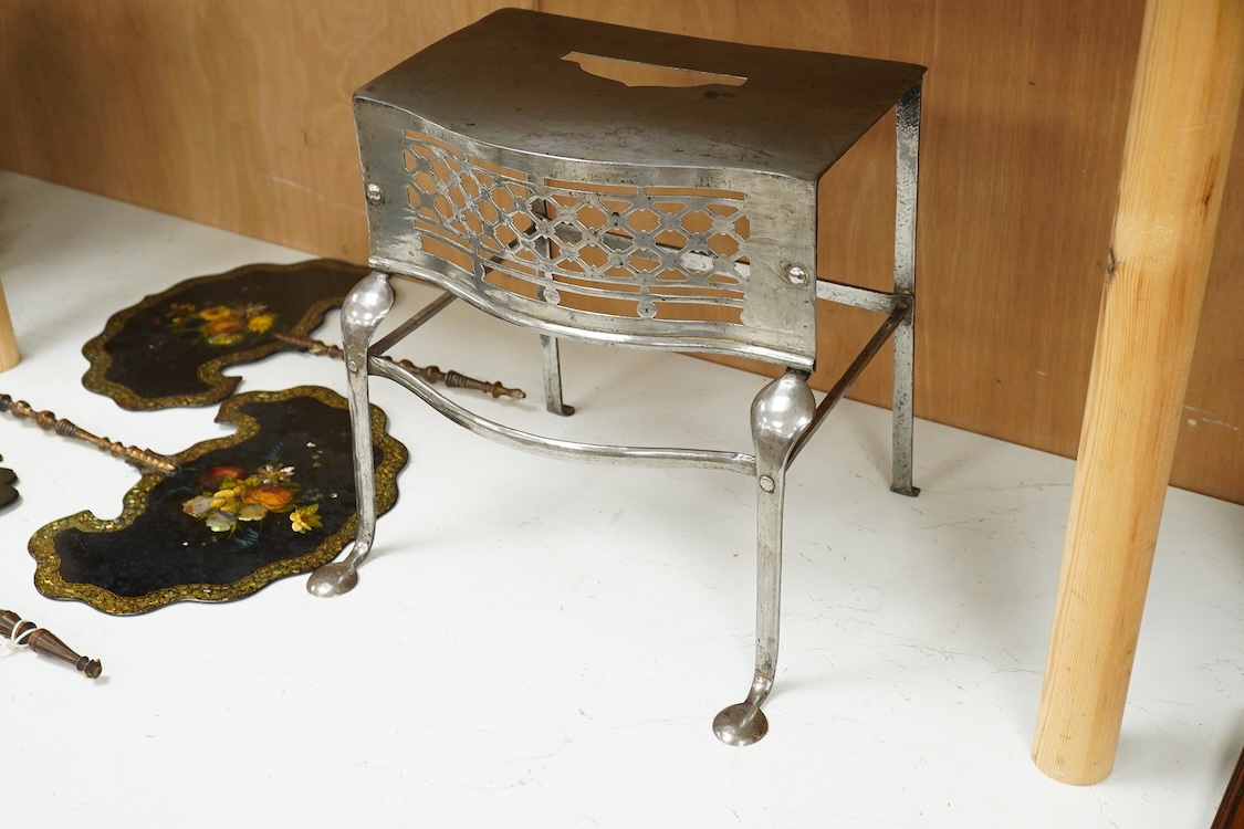 Two late Georgian pierced steel footman, 29cm high